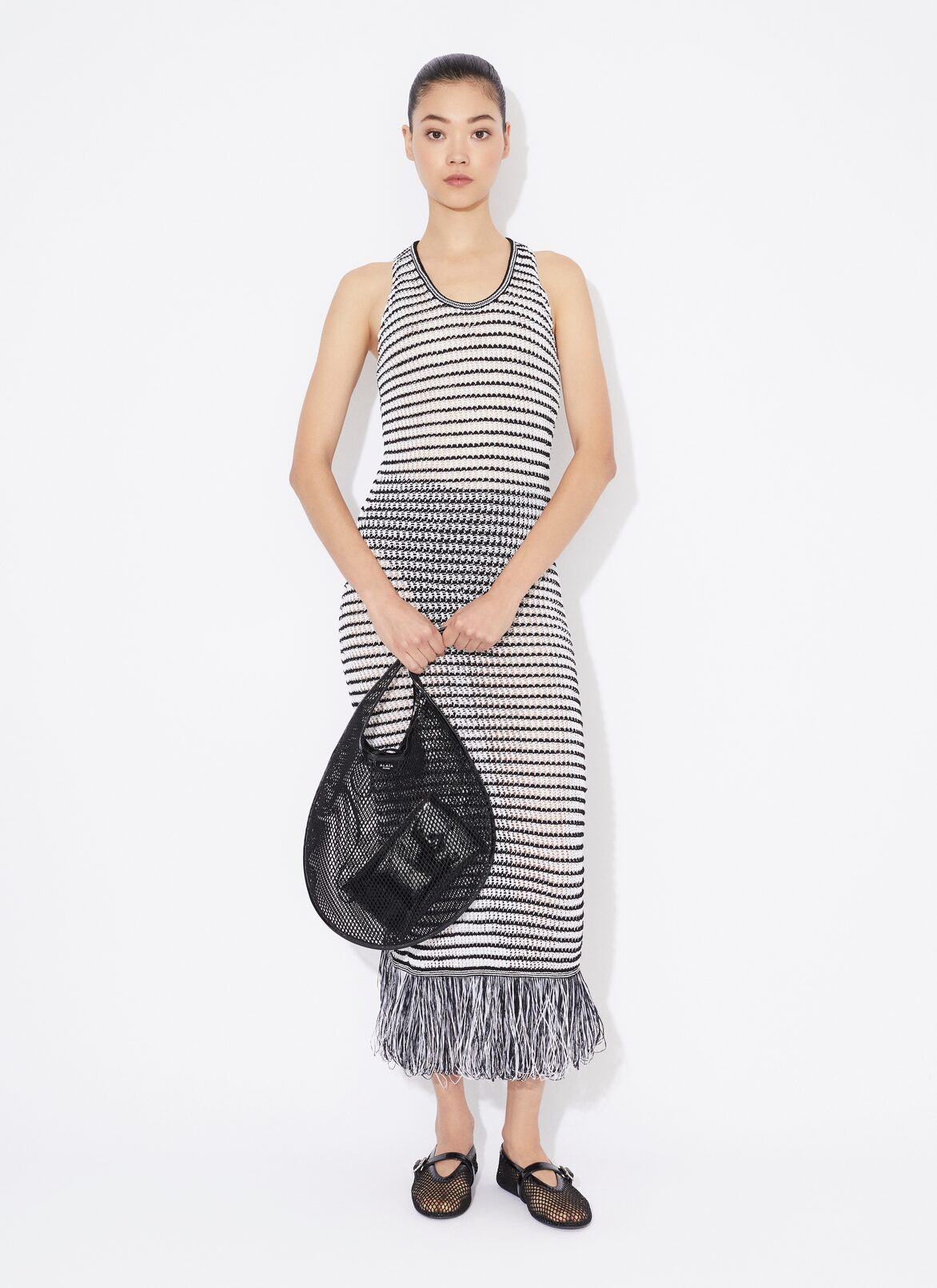 ABITO ALL'UNCINETTO CON FRANGE BODY CONSCIOUS  ALAÏA ABITO ALL'UNCINETTO CON FRANGE BODY CONSCIOUS  BIANCO/NERO